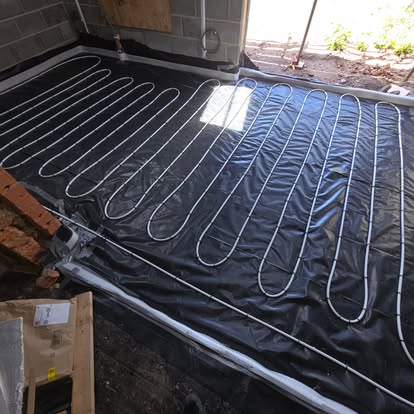 Wet underfloor heating pipework laid before screed